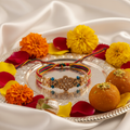 Beautiful traditional Rakhi bracelet with colorful threads and golden beads
